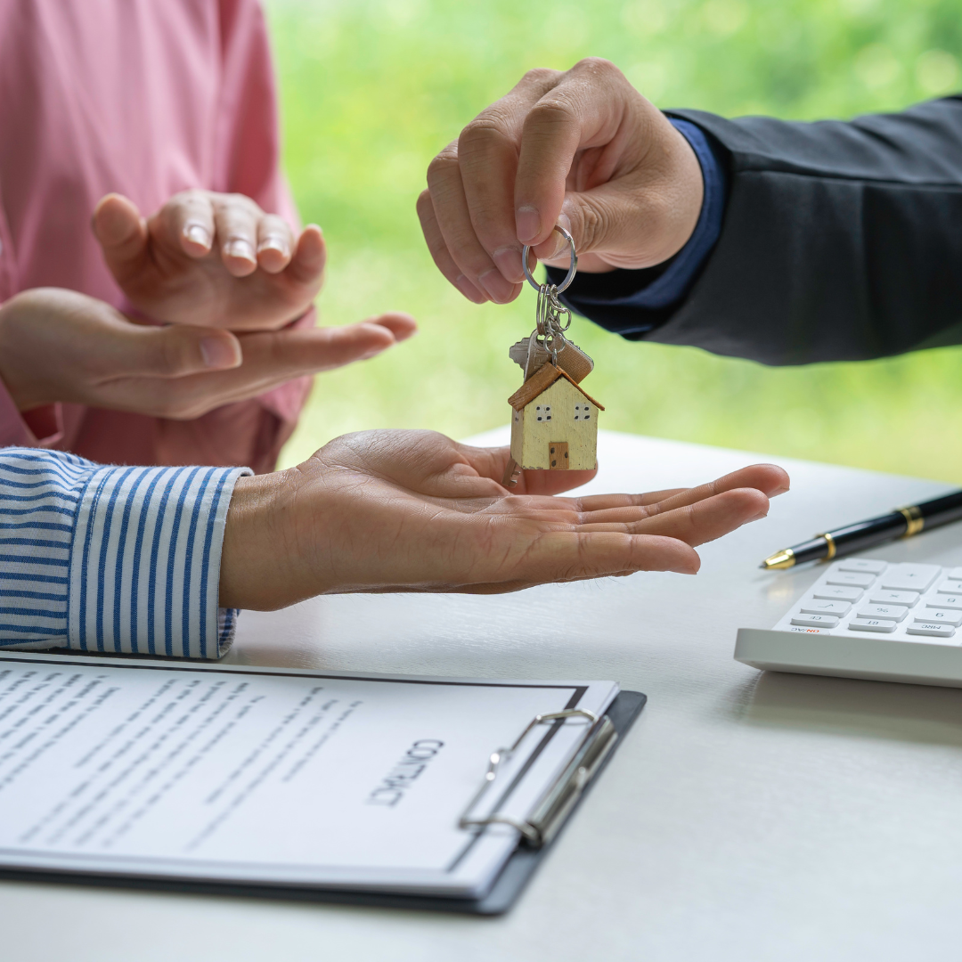 A person receiving house keys over a contract, representing legal advice on declarations of trust, co-ownership, and property rights from Martin Shepherd Solicitors in Hertford, Potters Bar and North Finchley.