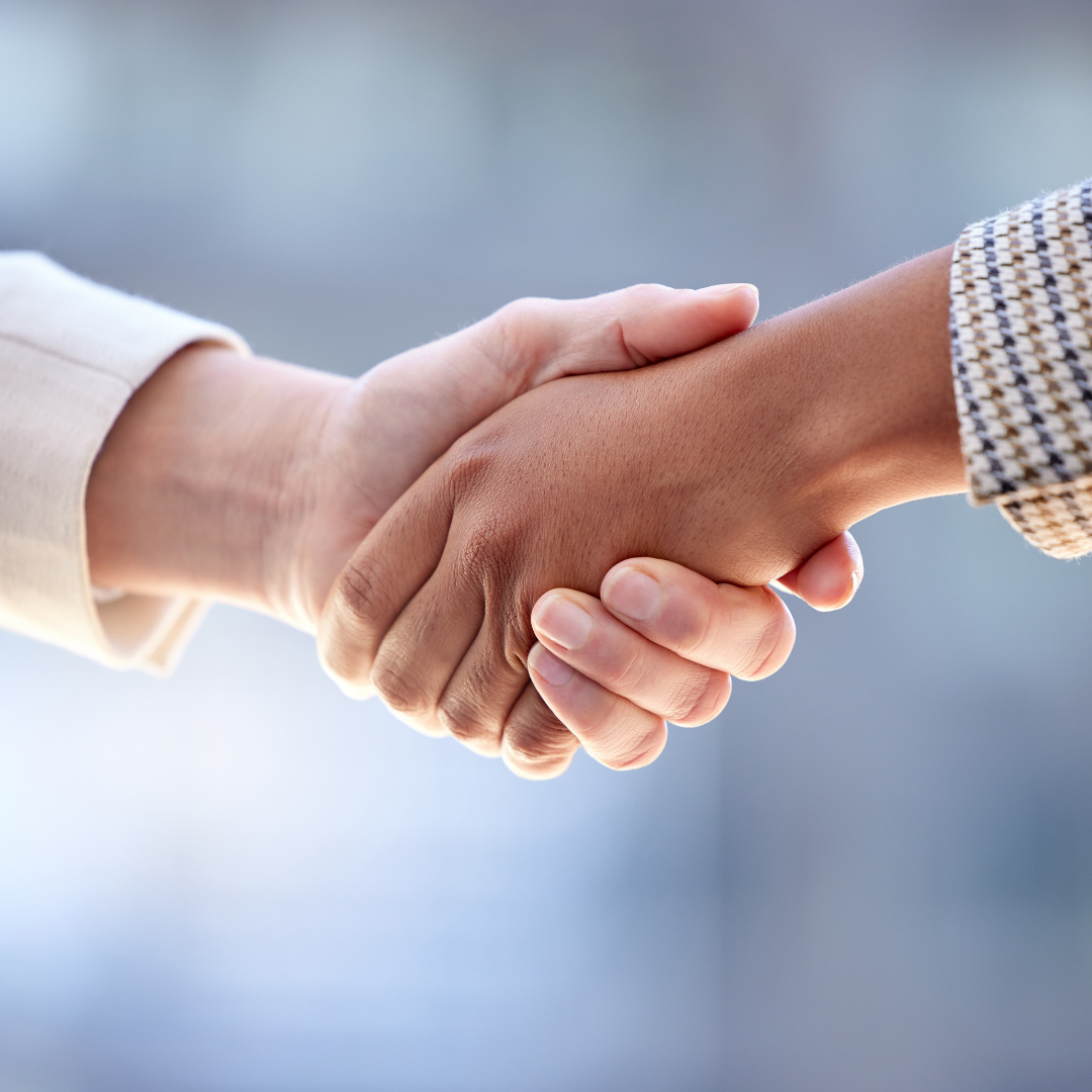 Close-up of a professional handshake, illustrating the supportive legal services offered by Martin Shepherd Solicitors across Finchley, Potters Bar and Hertford.